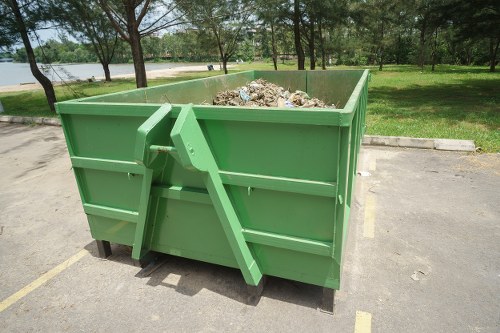 Workers managing and sorting construction debris
